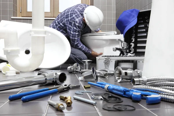 depositphotos 191173750 stock photo plumber at work in a